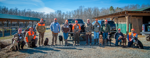 The volunteer dog handlers for the pheasant hunt. 